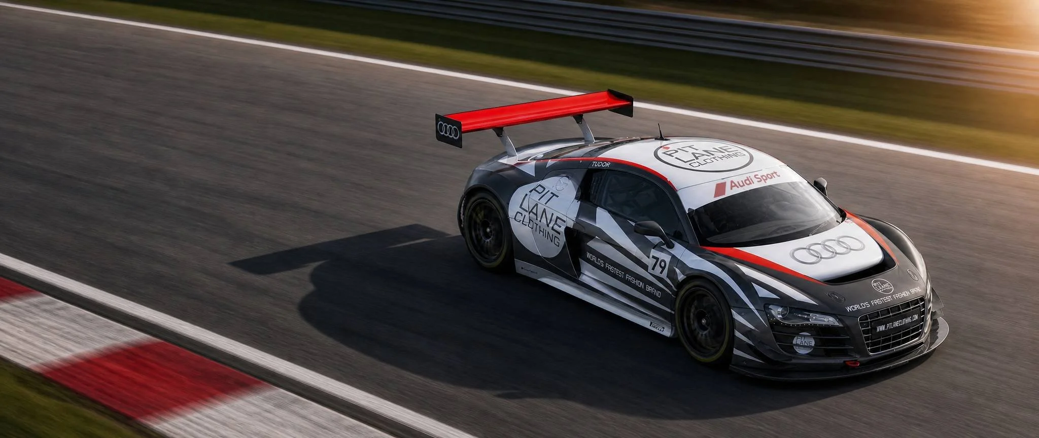 PIT LANE CLOTHING Audi R8 GT race car speeding around a racetrack