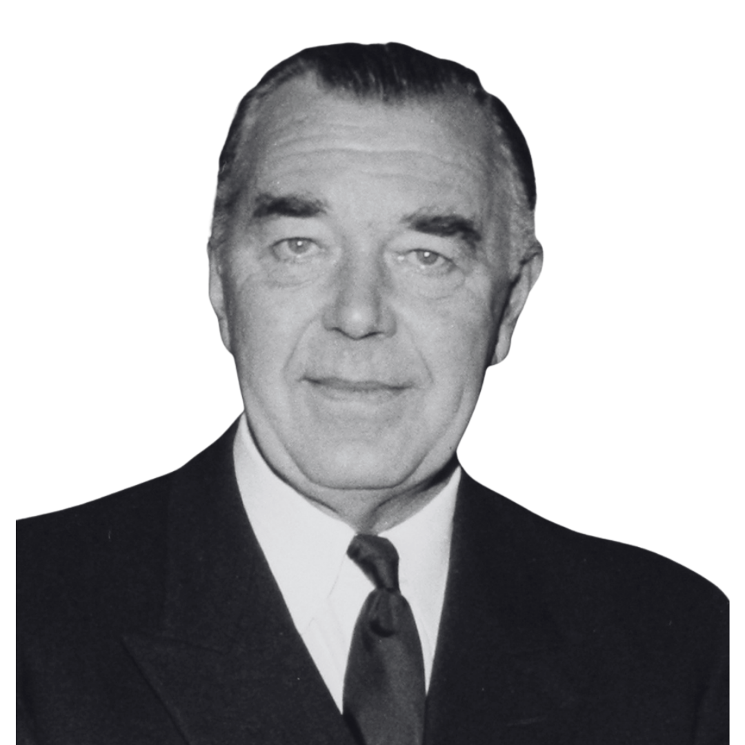 Black and white portrait of a man in a suit and tie.