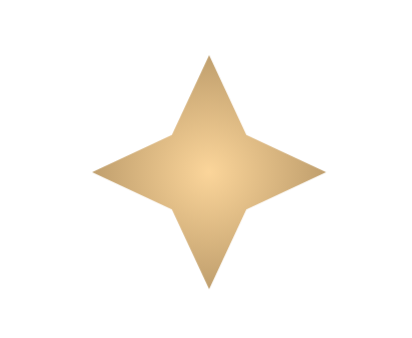 Close-up of a shiny, metallic, pinwheel-like object with four blades in gold, against a plain background.