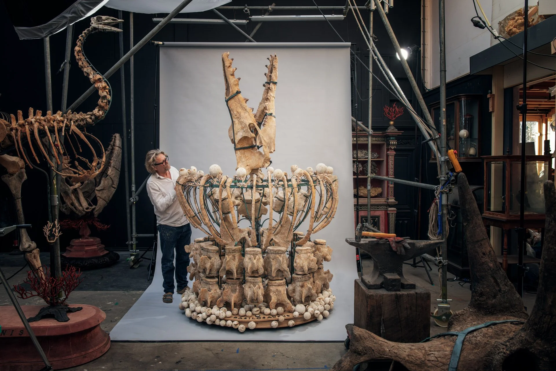 Ferry van Tongeren next to Basilosaurus artwork in their atelier. Photo: © Tim Mintiens