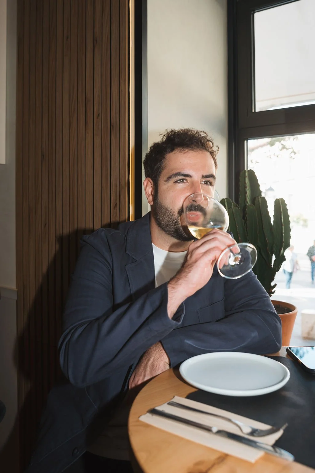 Victor Barcelo the founder of Flavours of Madrid, enjoying a glass of wine