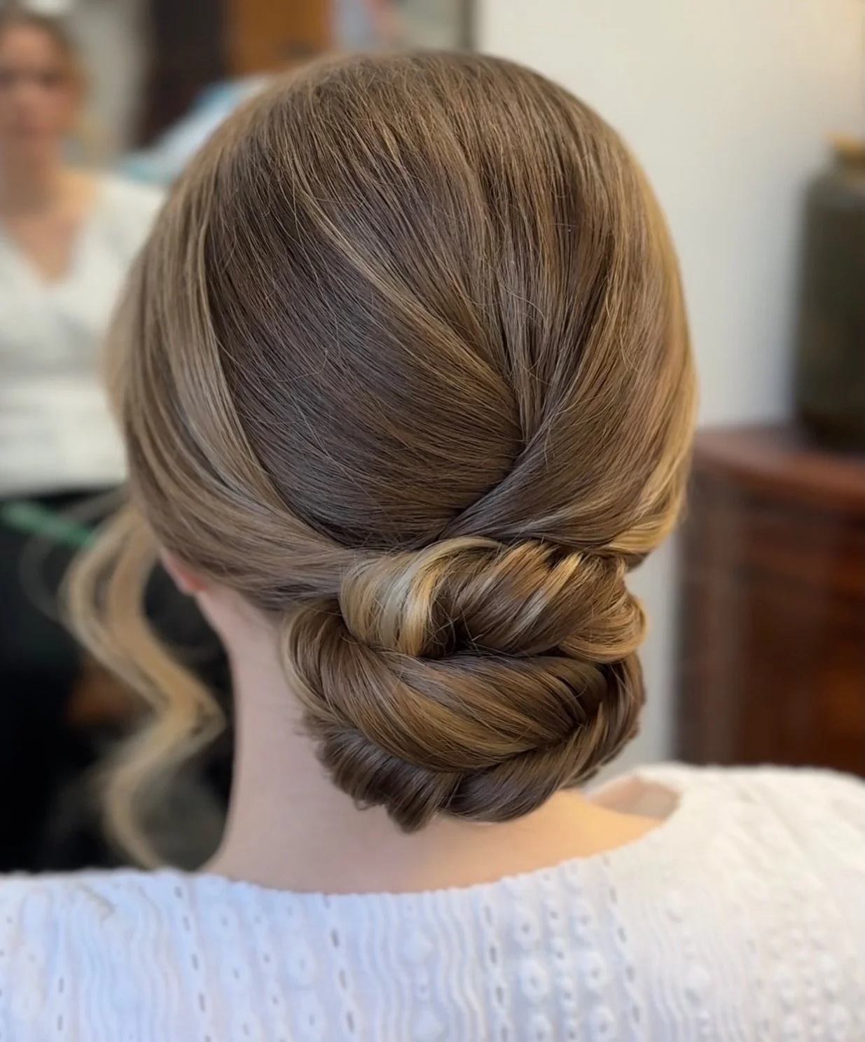 She wanted this low bun to feel a little woven with twist vibes. In the end this one didn&rsquo;t make the cut &mdash; and we went a totally different direction that felt more like her. Want to see which style did? 👀