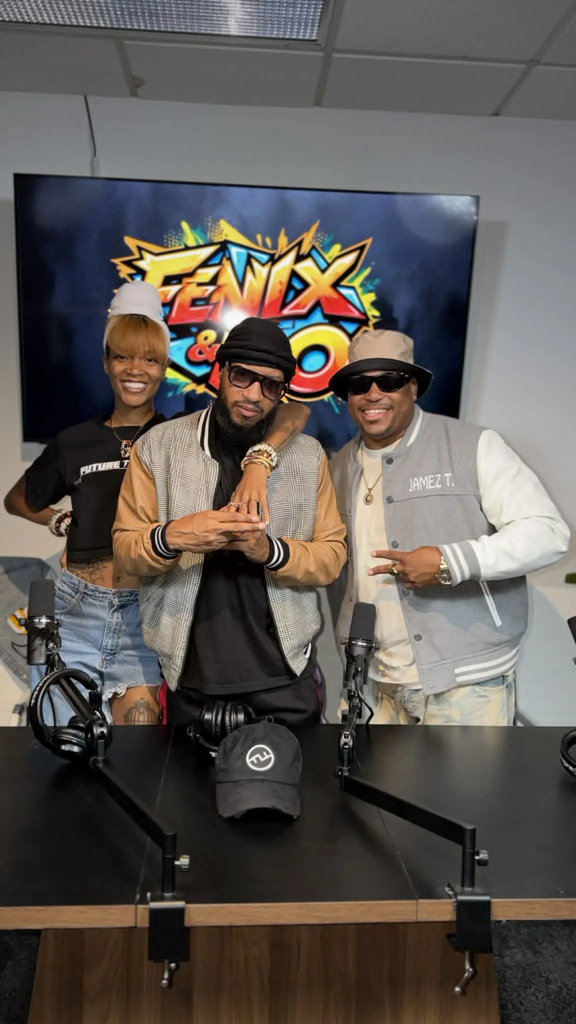 Jamez T. posing with the owners of Fenix and Flo Podcast Show