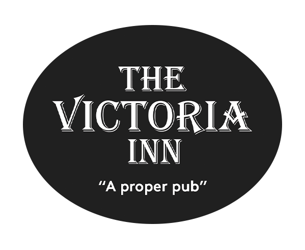 Logo for The Victoria Inn with the tagline 'A proper pub' in white text on a black oval background.