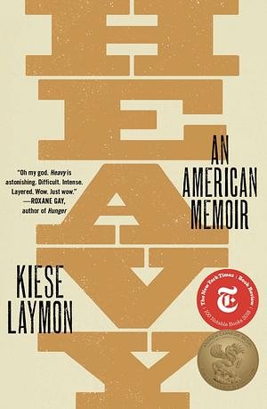 Book cover titled 'HATE' with the subtitle 'An American Memoir' by Kiesea Laymon. The cover features a large, stylized, vertically arranged word 'HATE' in gold color against a light background. There are quotes and a gold medal-like emblem on the low