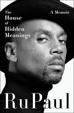 The cover of RuPaul's memoir titled 'The House of Hidden Meanings', featuring a black-and-white close-up photo of RuPaul wearing a black beret and turtleneck, with a serious expression.