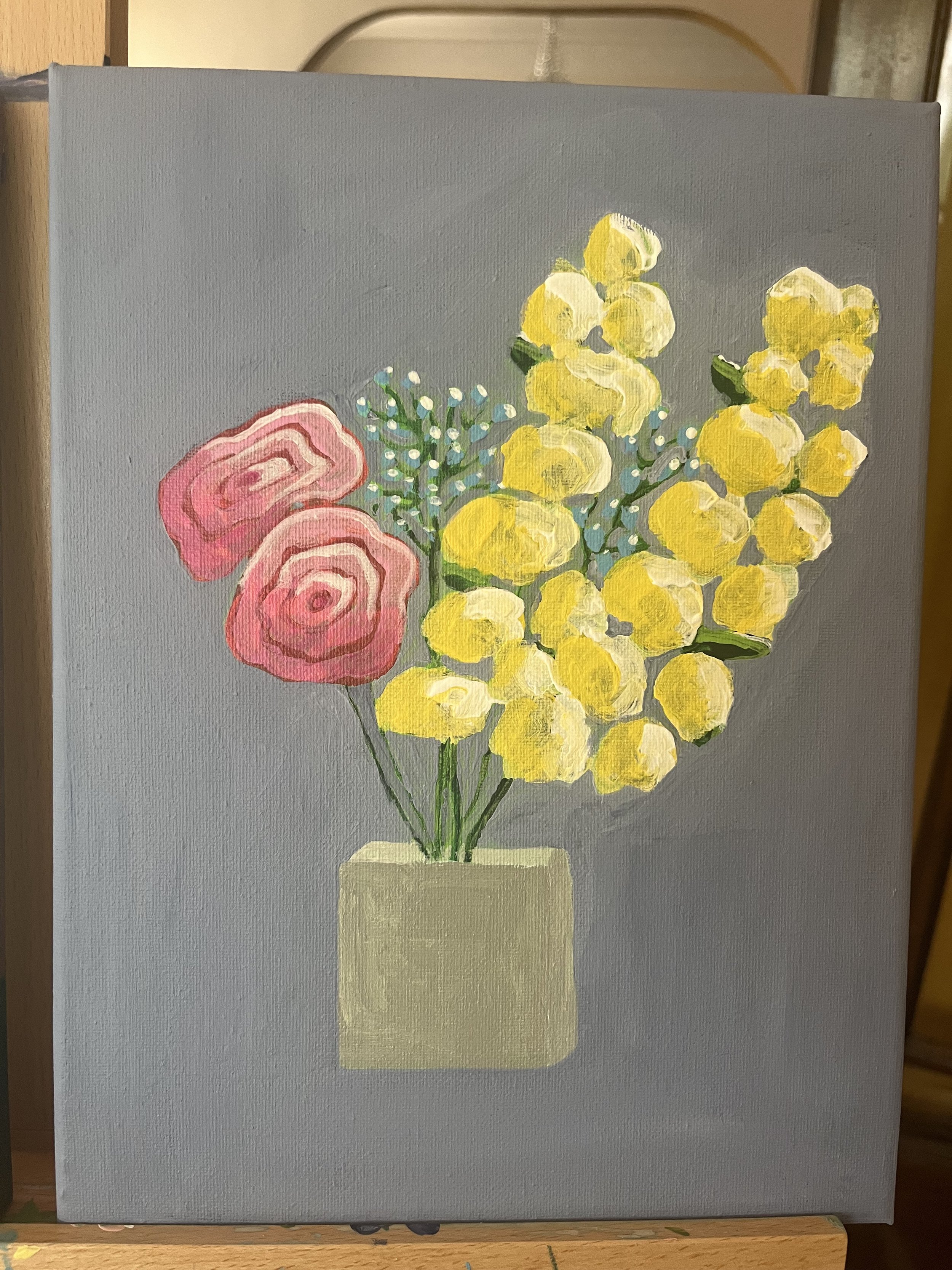 A painting of a floral arrangement in a light yellow vase, featuring pink roses, yellow flowers, and small white and green filler flowers on a gray background.