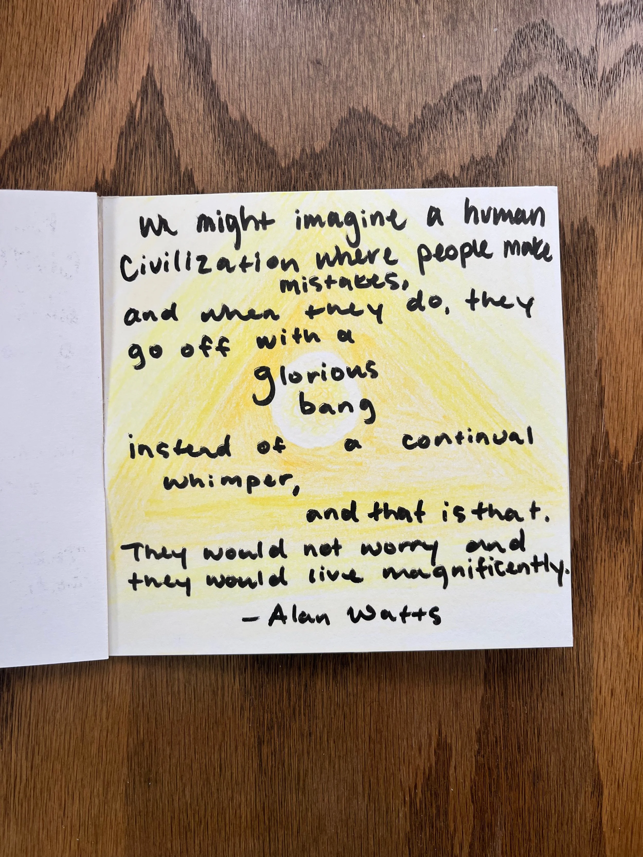 Handwritten quote on a card with a yellow drawing behind it. The quote discusses human civilization, mistakes, a glorious bang, and living magnificently, attributed to Alan Watts.