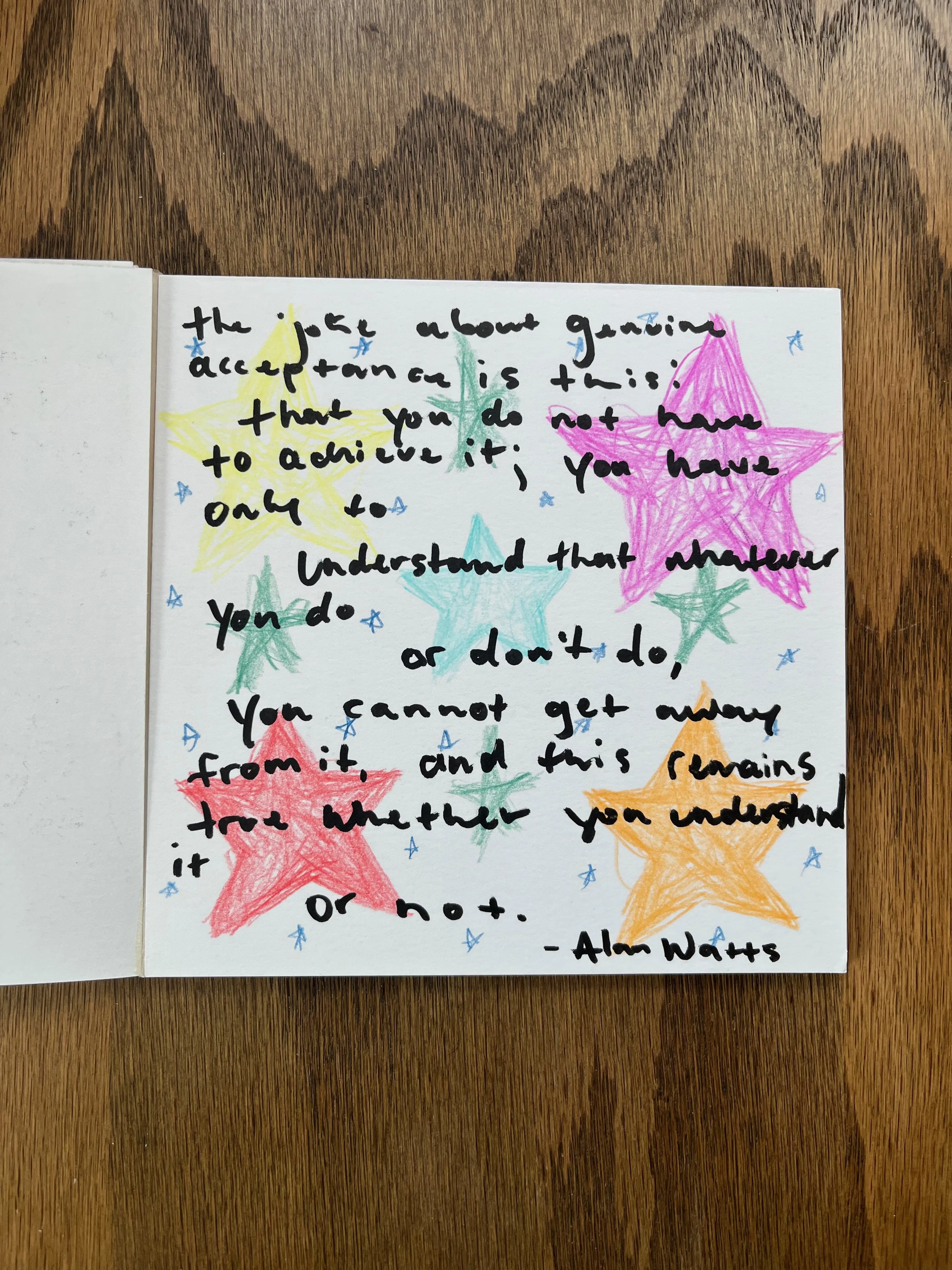 Handwritten note on paper surrounded by colorful stars and small decorative stars. The note reads: 'the more about gaining acceptance, is this: that you do not have to achieve it; you have only to understand that whatever you do or don't do, you cann