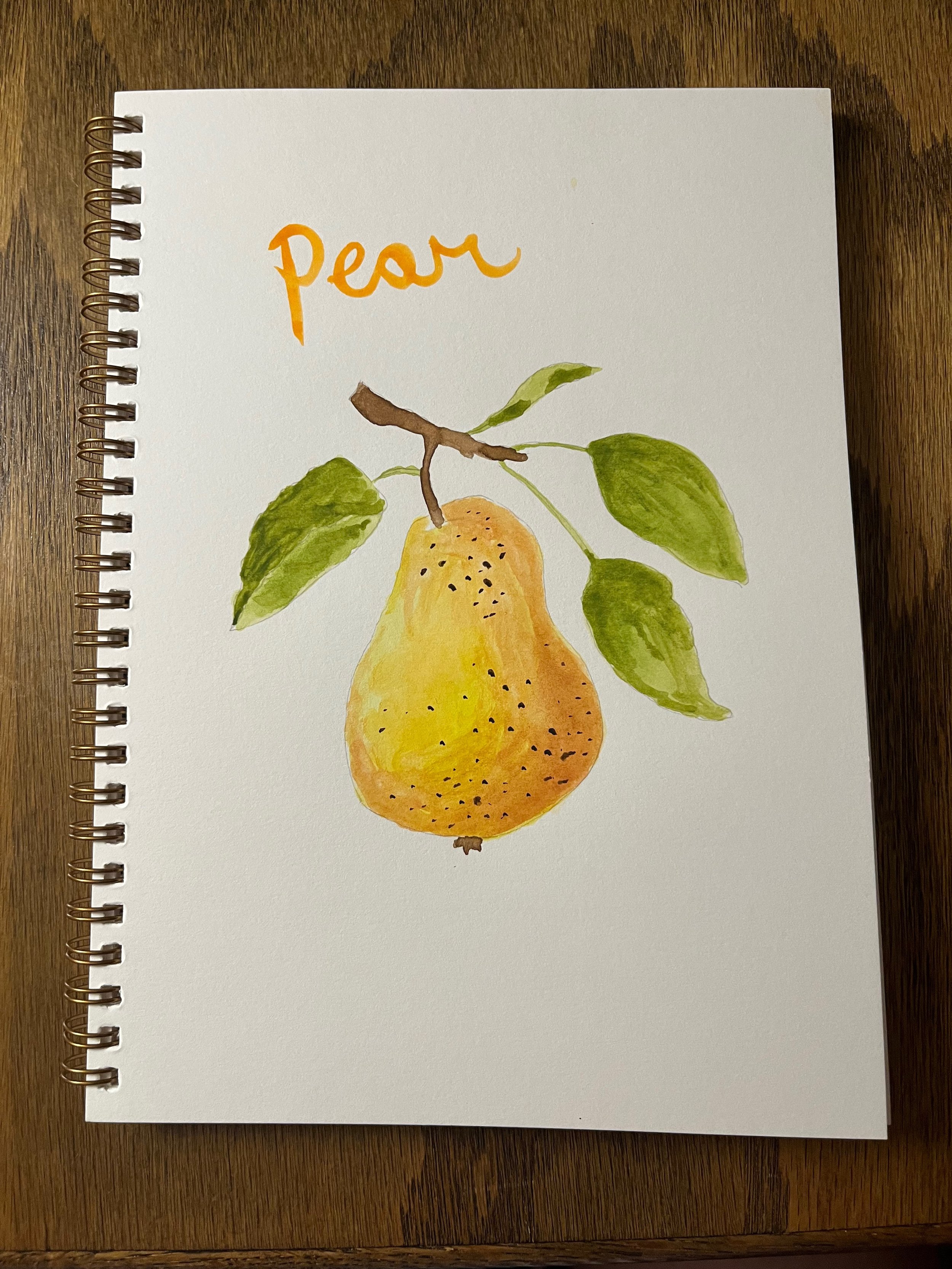 Watercolor painting of a pear hanging from a branch with green leaves. The word 'Pear' is written in orange at the top.