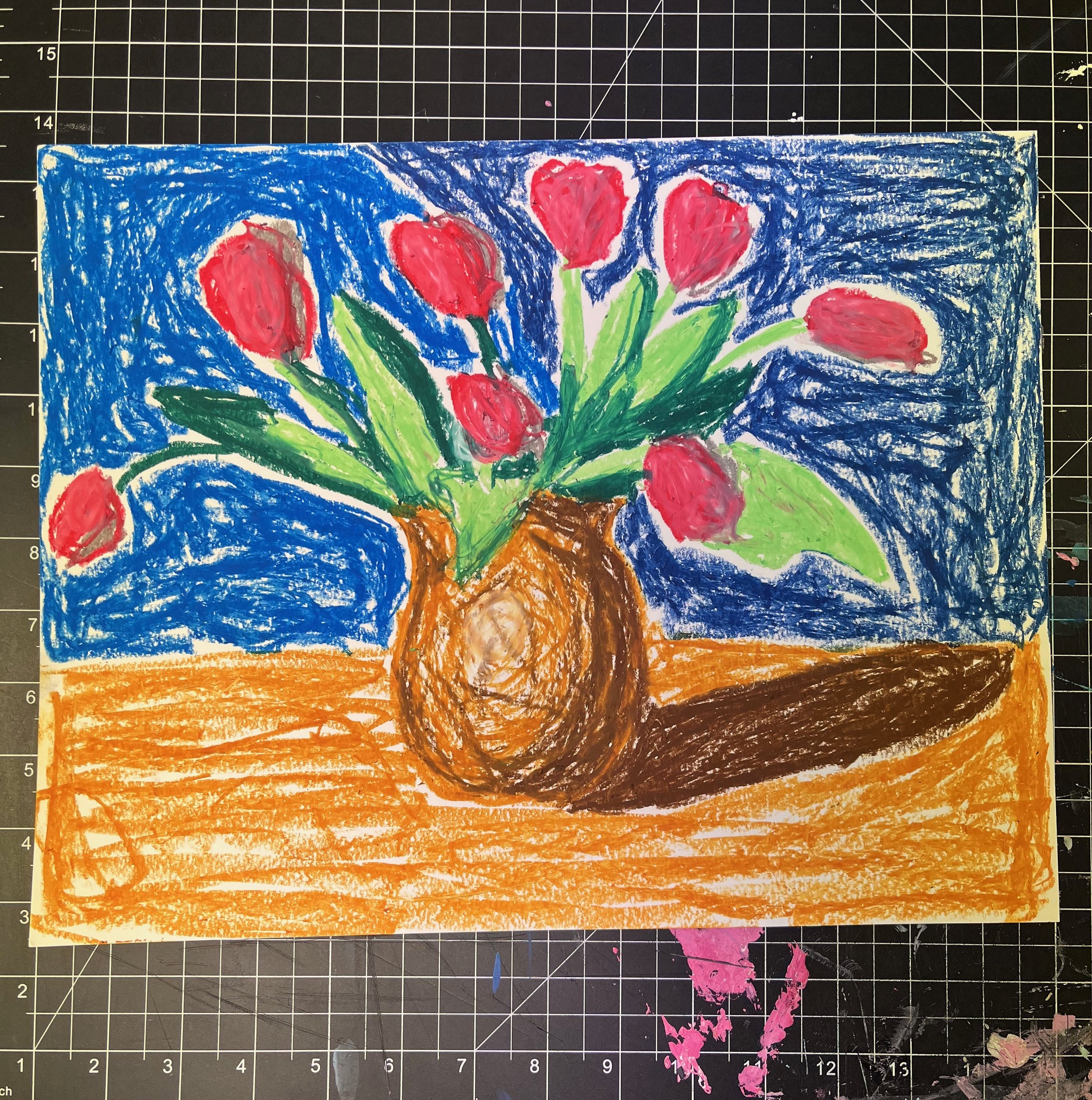 Children's crayon drawing of a vase with red tulips on a table, with a blue background and orange surface.