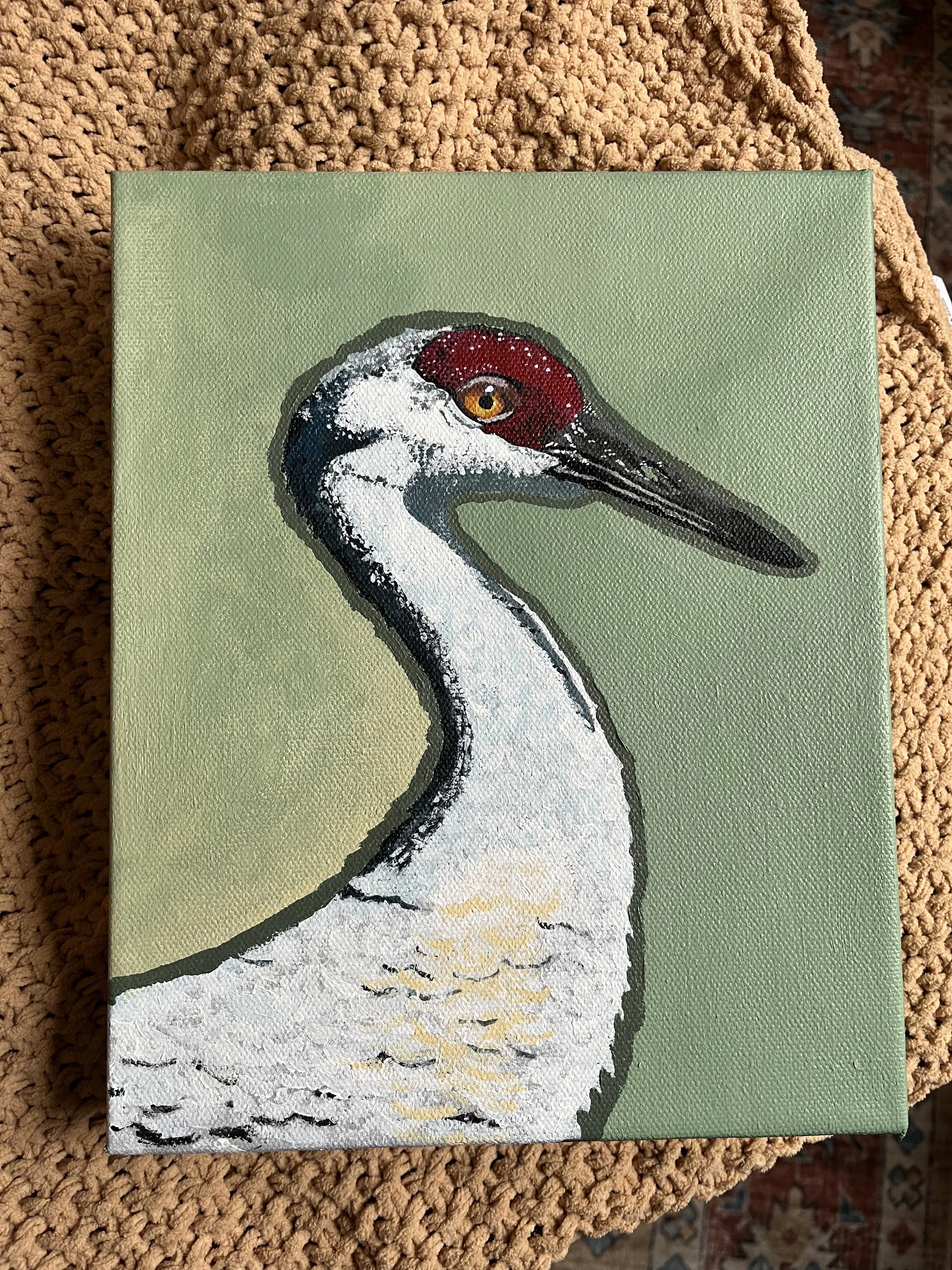 Painting of a crane with a green background.