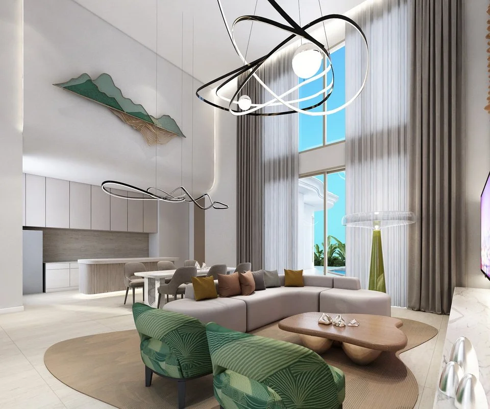 Modern living room with high ceilings, large windows, and contemporary furniture, including a white sectional sofa with colorful pillows, green patterned chairs, a wooden coffee table, and artistic lighting fixtures.