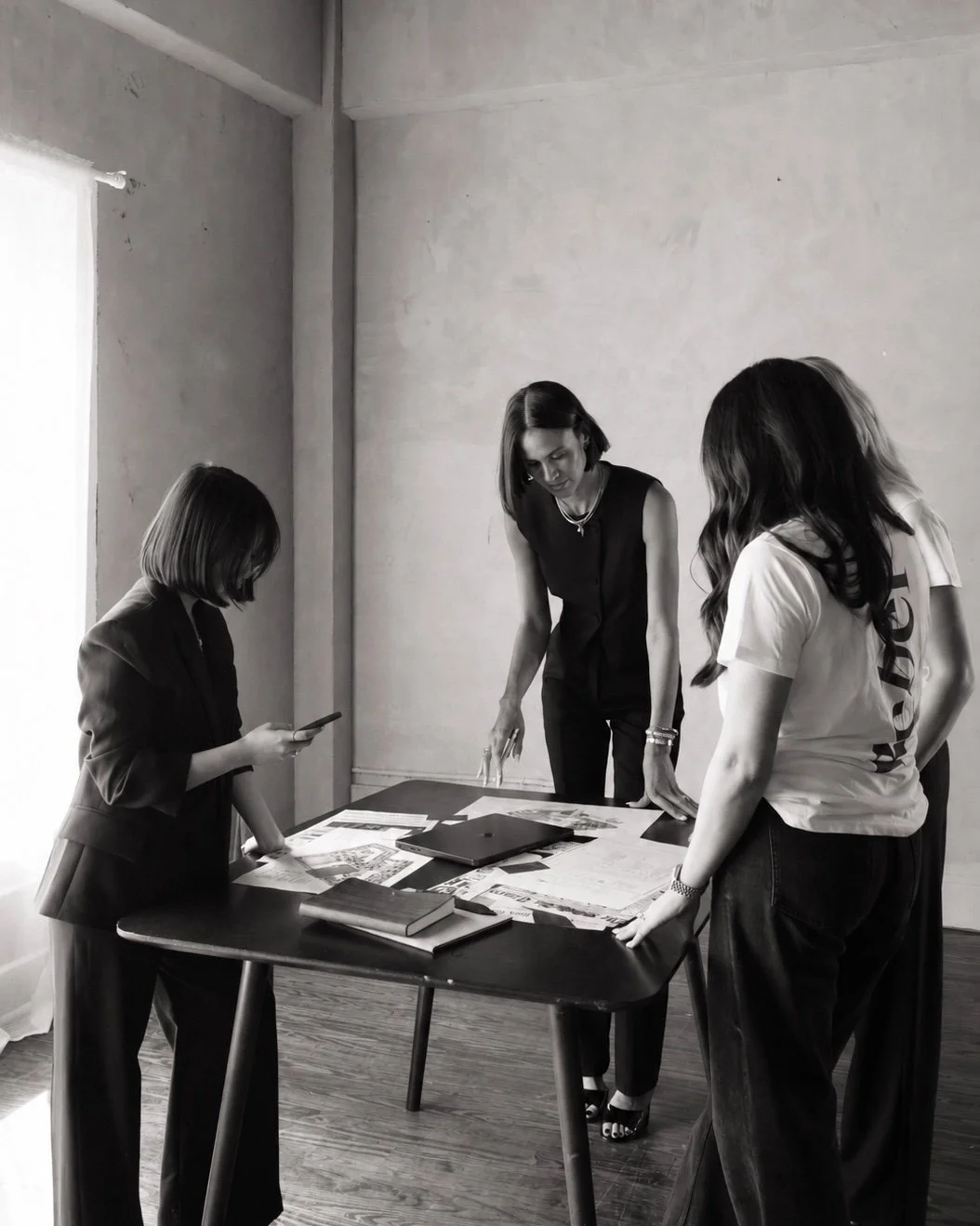 The Rebel Retail Advisors team collaborating around a project table
