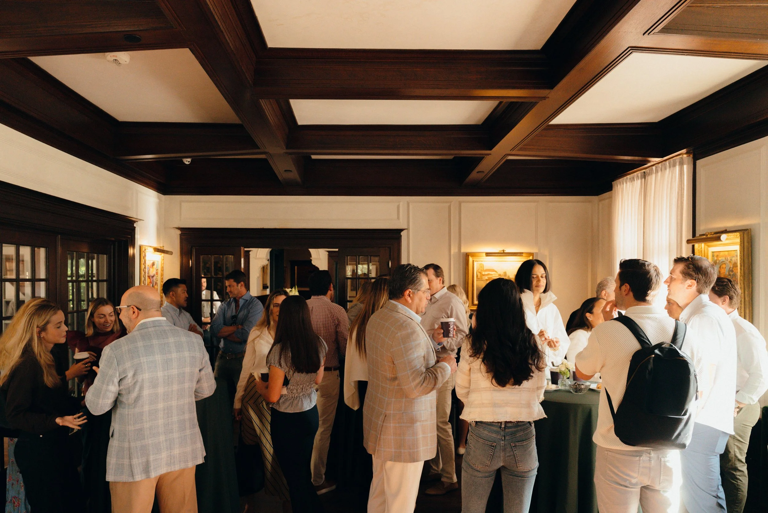 Retail professionals gathering at a Rebel Retail Advisors event