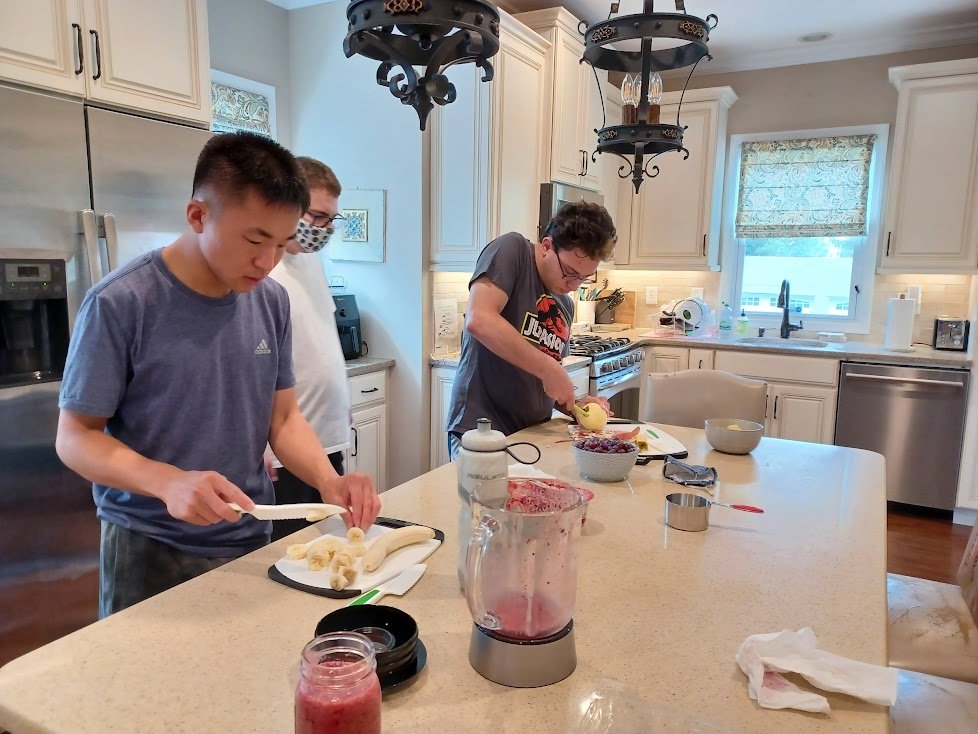 20220726 Stephen Cuts Bananas and Ben Peels and Cuts Apples for Fruit Salad.jpg