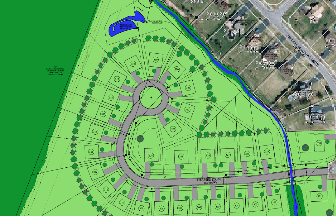 A residential neighborhood plan showing a circular street layout with numbered lots, green spaces, trees, a small creek, and a stormwater management pond.