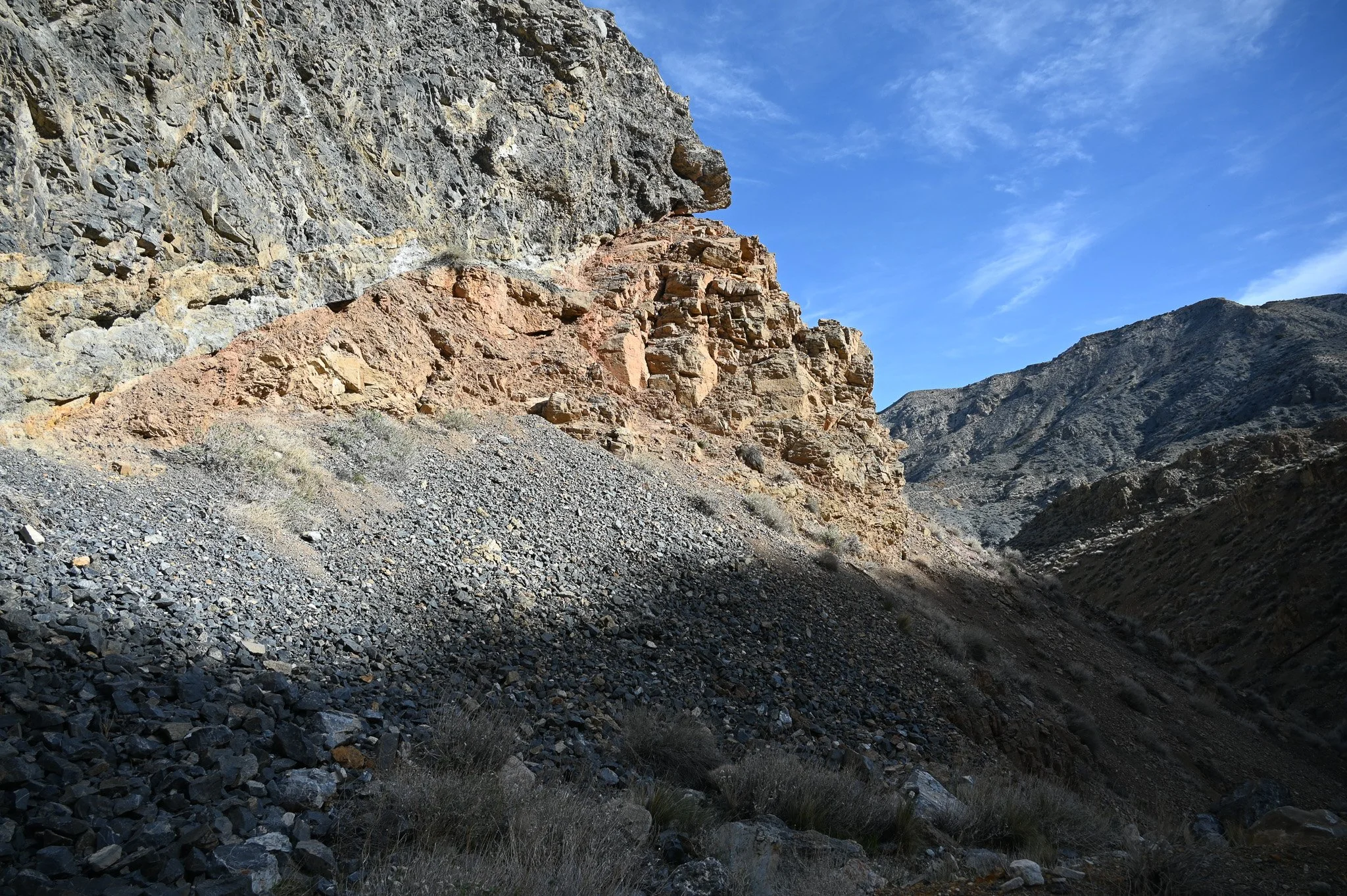  The orangish rock is the ore bearing unit that Lemoigne and later miners mined. 