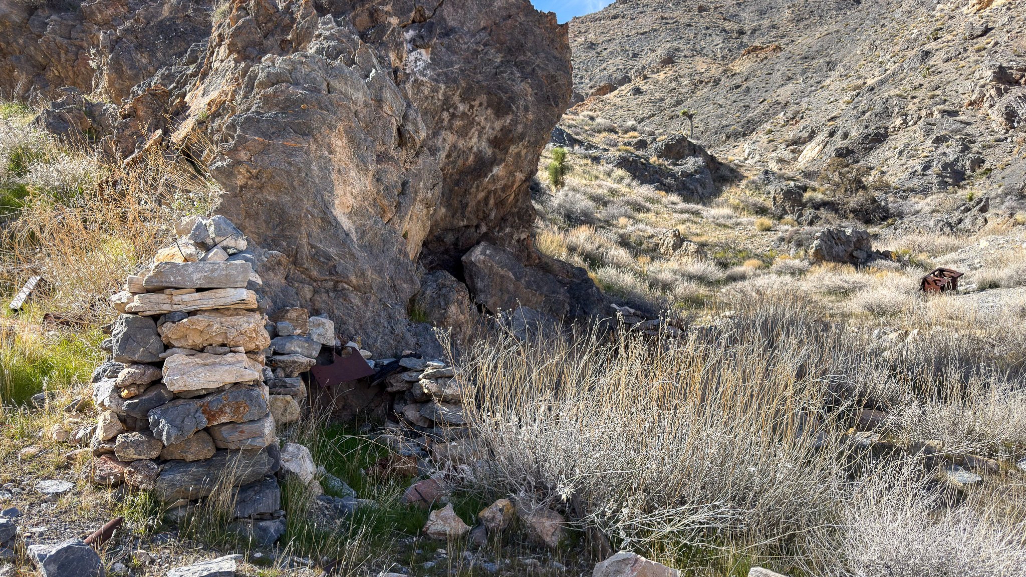  Rock stove and cistern at the cabin site. 