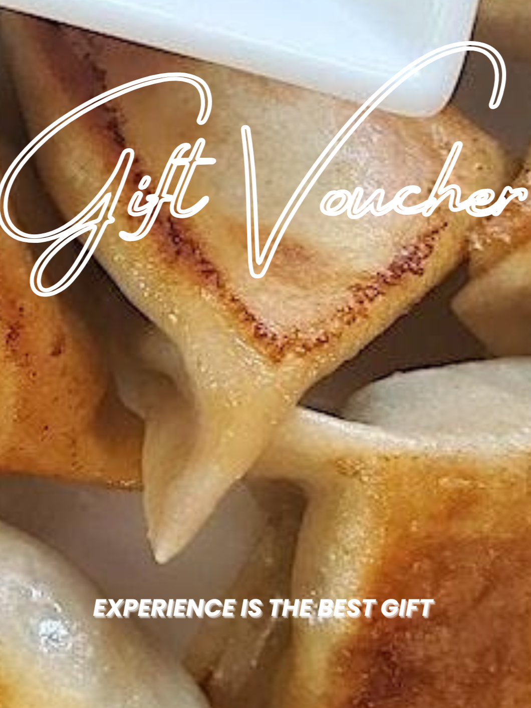 Close-up of assorted fried dumplings with crispy edges and a white container on top, with overlaid text reading 'Gift Vouchers. Experience is the best gift.'