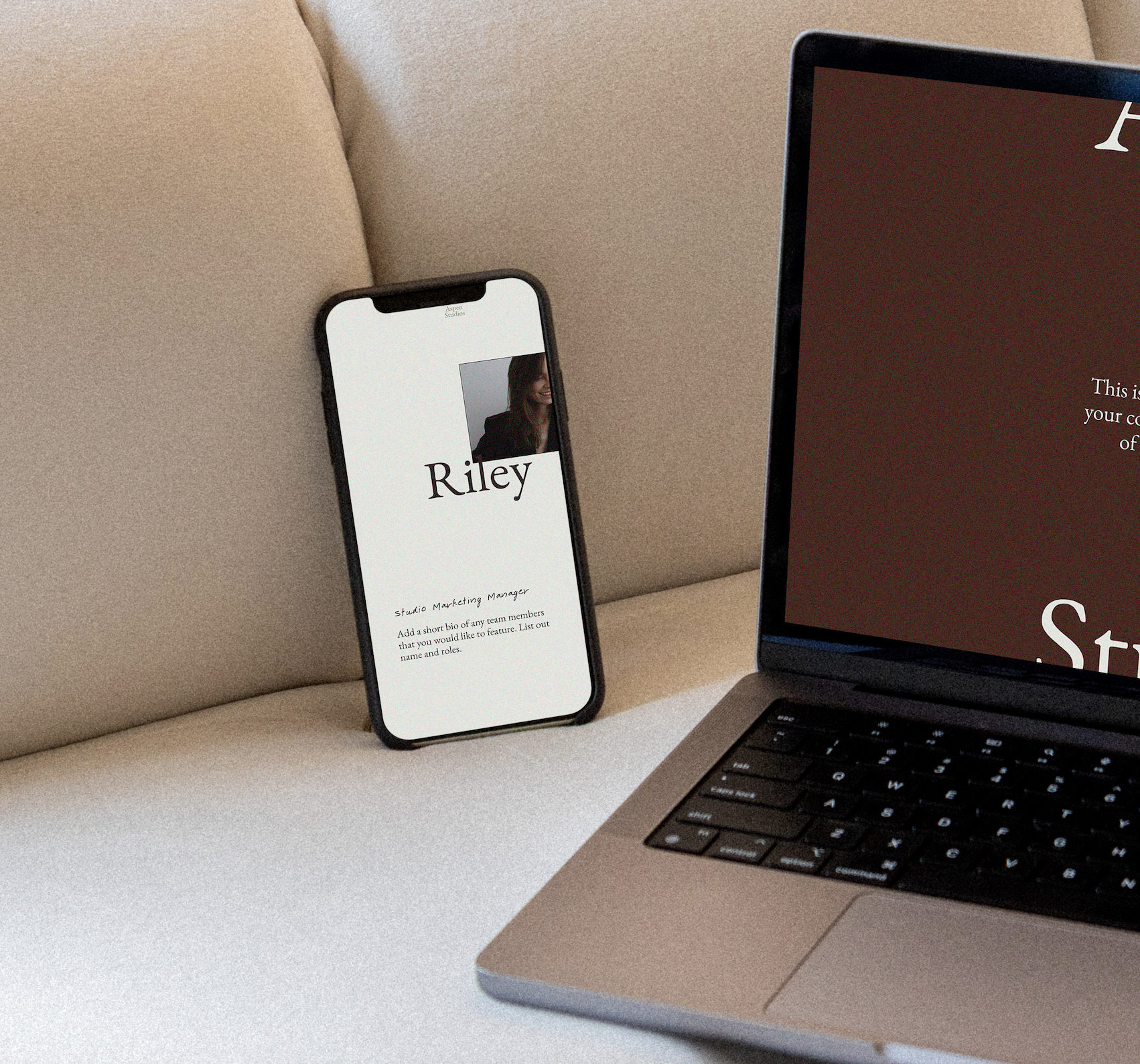 A smartphone displaying a profile page with the name Riley and a photo of a woman, next to a laptop on a beige sofa.