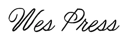 Silhouette of a person standing on a cliff at sunset