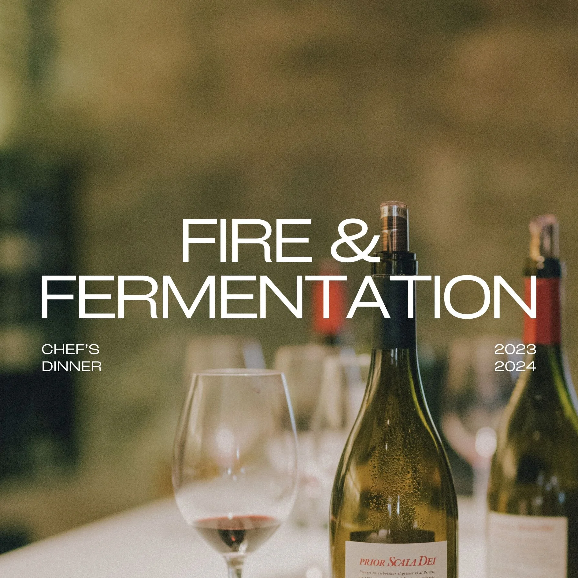 Close-up of wine bottles and a glass of red wine on a table, with overlay text: 'Fire & Fermentation,' 'Chef's Dinner,' and year labels 2023 and 2024.