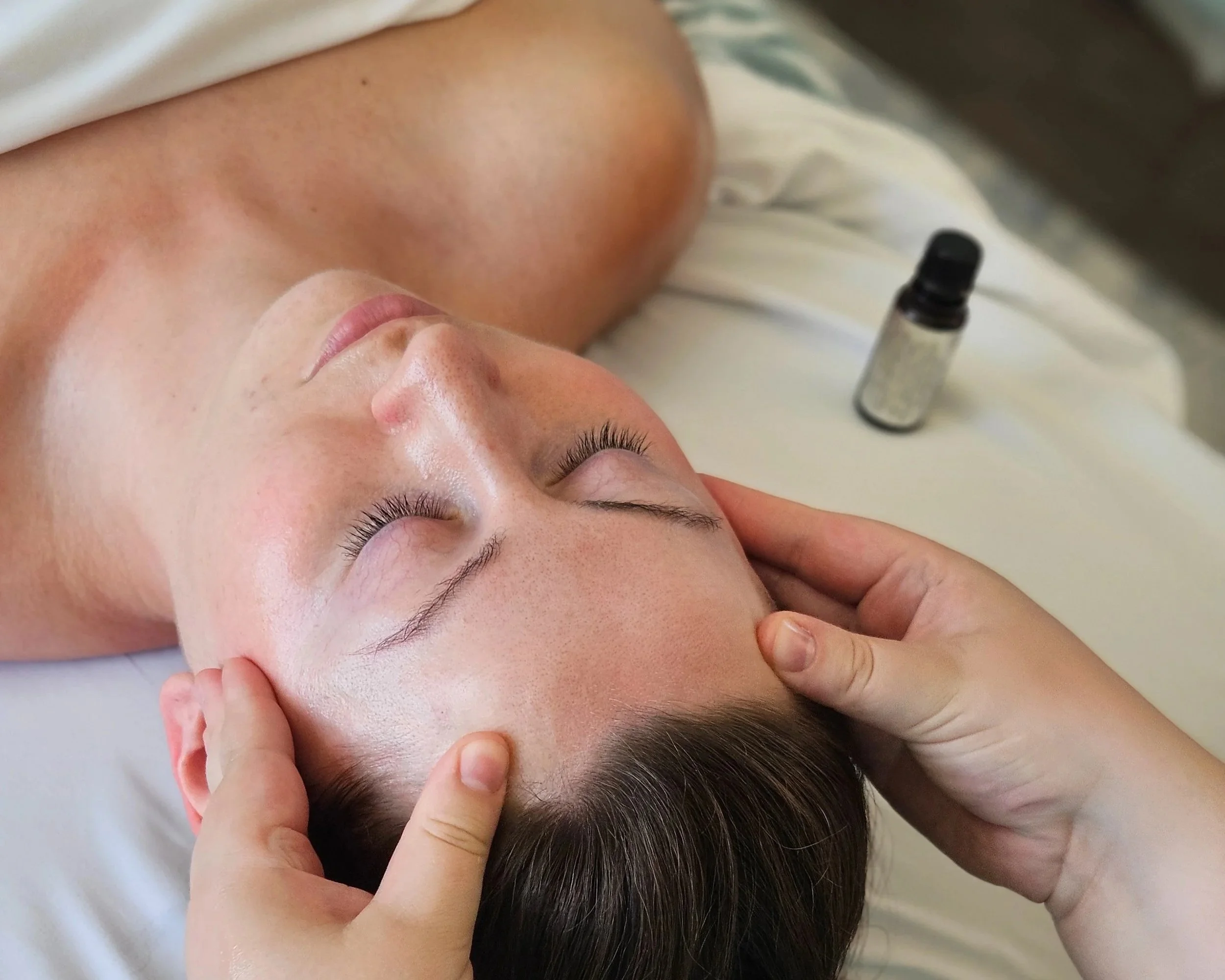 gentle head and face massage using peppermint oil to help relieve headaches and migraines from jaw tension