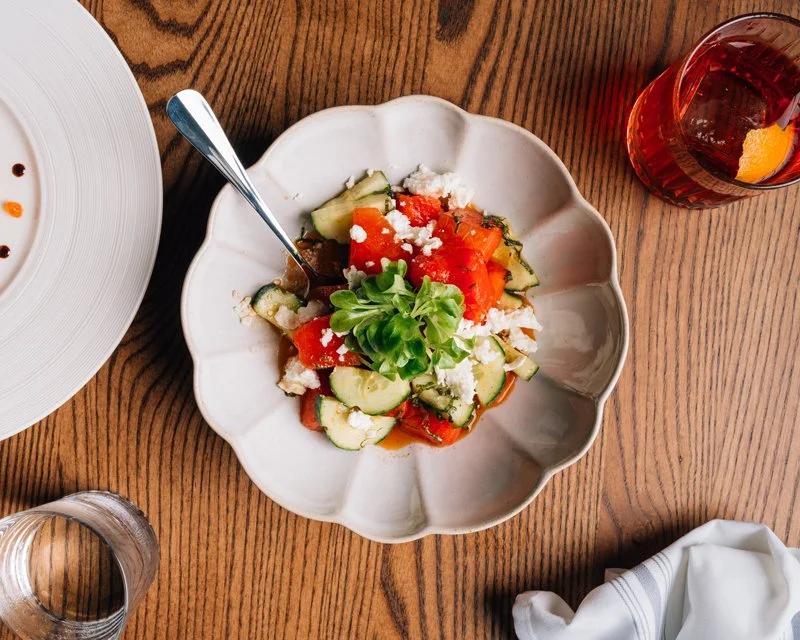 A ROLi watermelon and feta cheese salad on a white pate