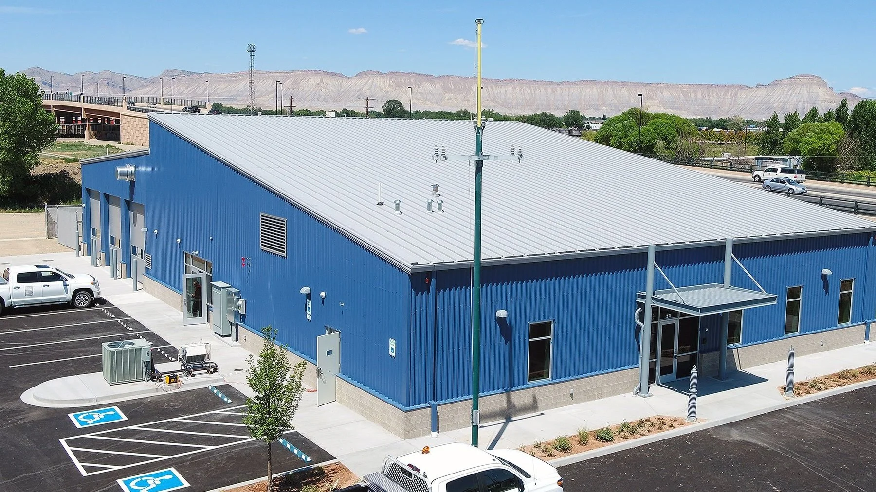 Colorado Mesa University line workers Aerial View. Louver installation by Comfort Air shown on the side of the building.