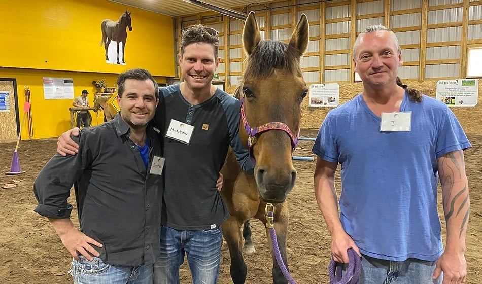 Mens group with engaged horse.jpg