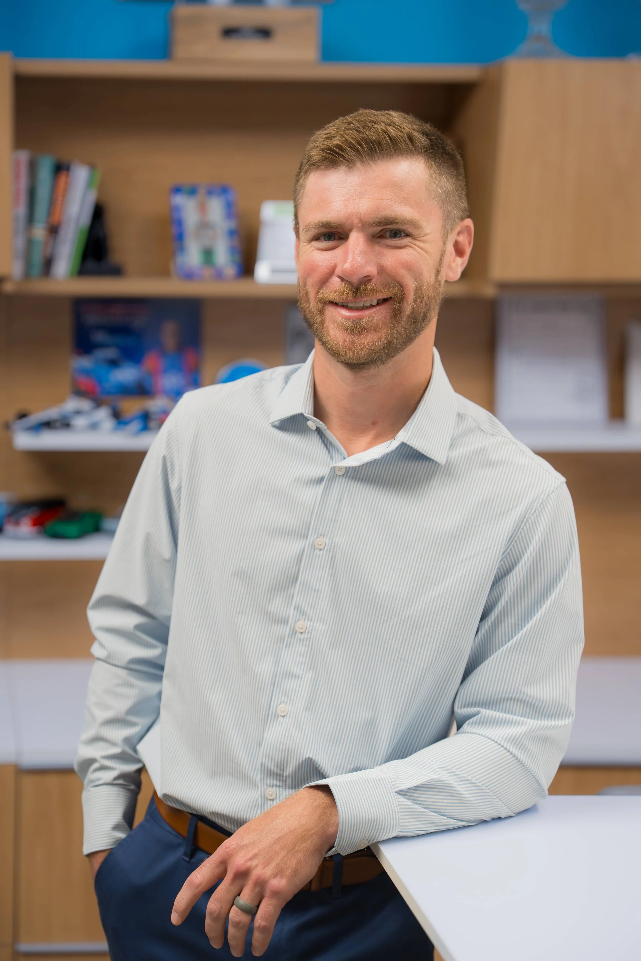 Second generation owner, Connor Allen, poses for a headshot in the ColorVision corporate office
