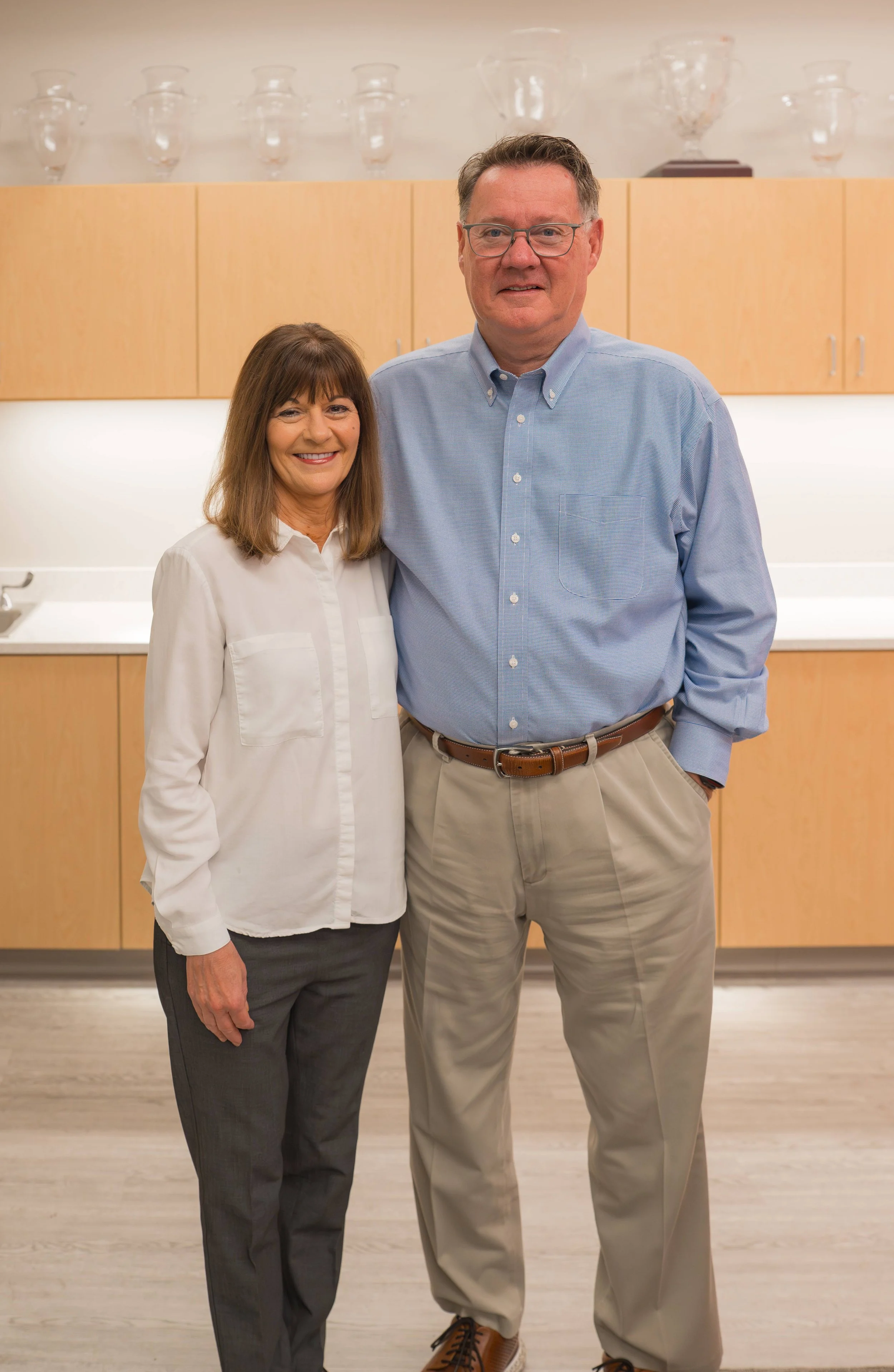ColorVision founders, Gary Allen and Kathy Allen, pose in the ColorVision corporate headquarters