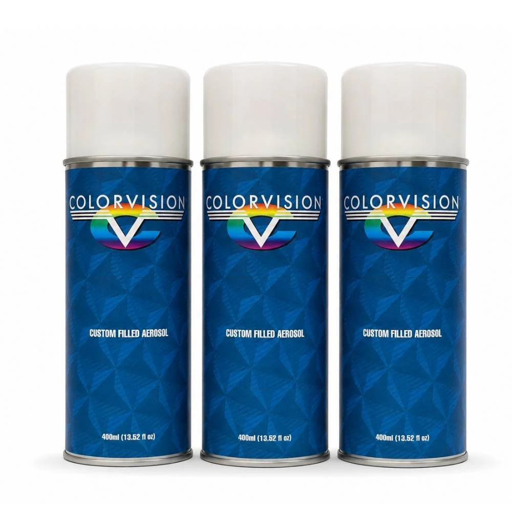 Three white-cap ColorVision custom filled aerosol cans with blue geometric branding and rainbow ColorVision logo, displayed side by side on a white background. Each can is labeled ‘Custom Filled Aerosol'.