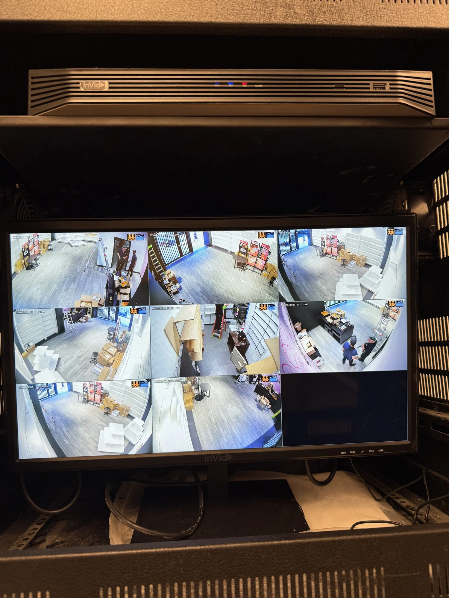 Recorded camera views from a warehouse on a monitor