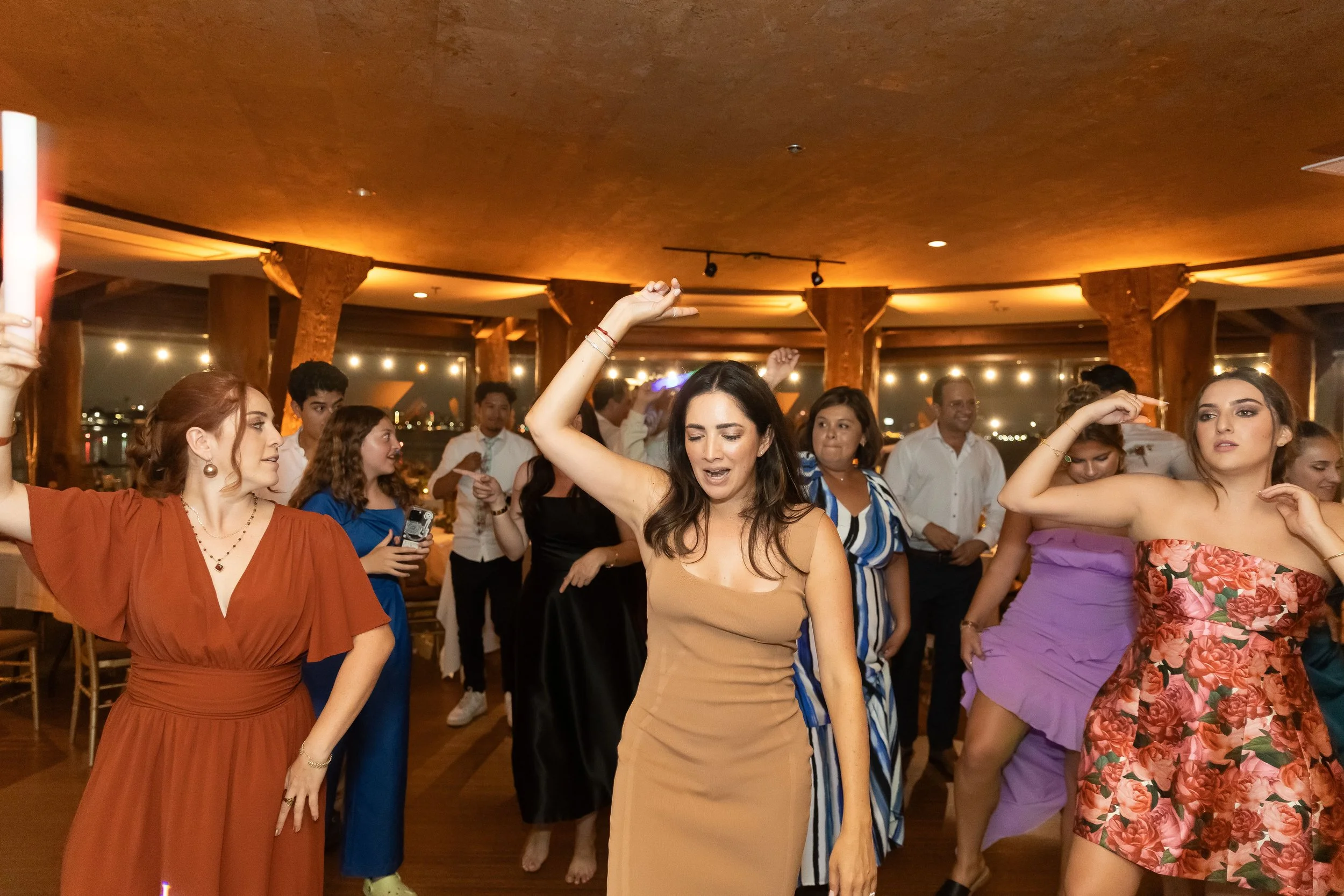 Woman leading line dance at wedding