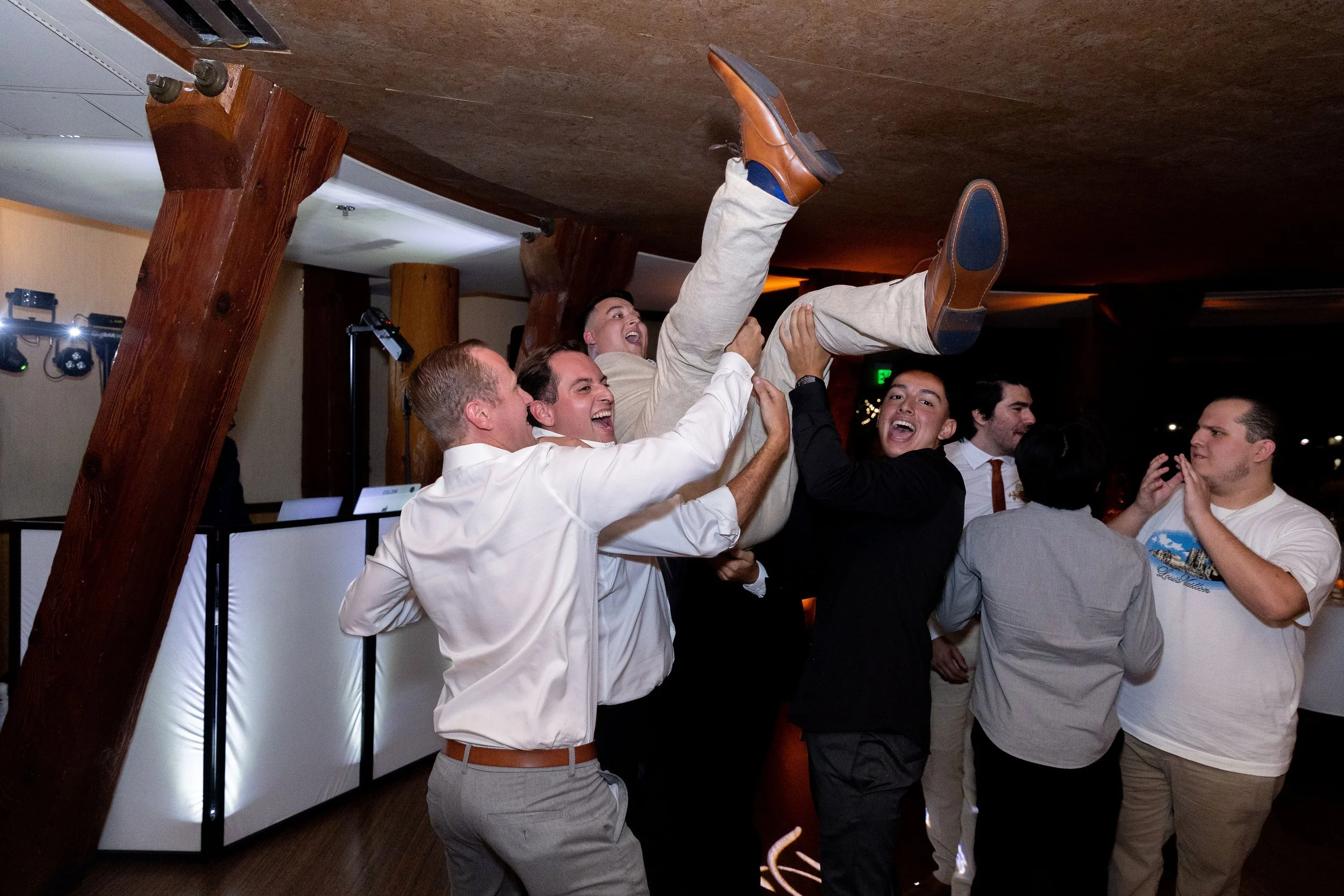 Group of guys dancing at weddiing