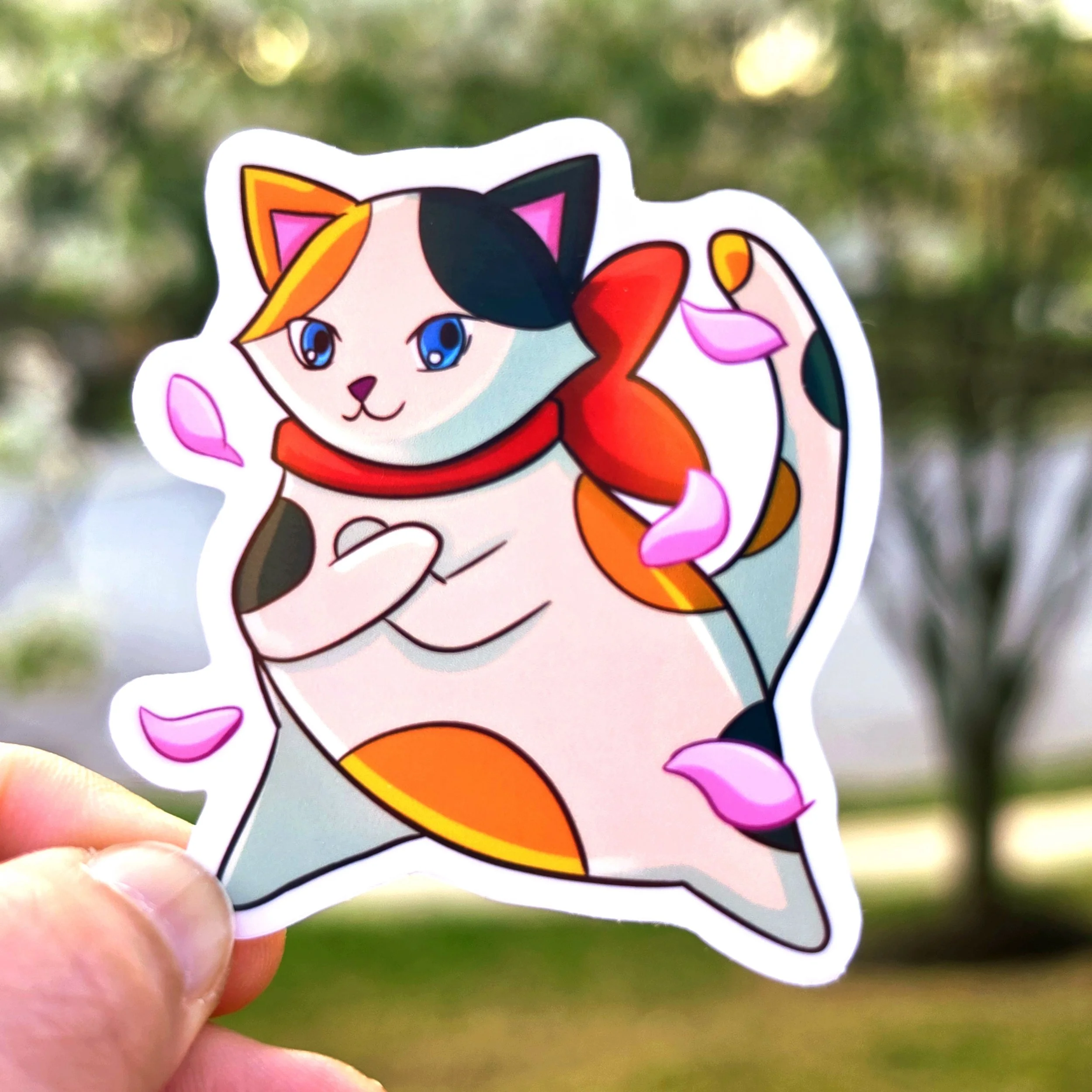 A calico cat based on Nico Robin. The feline poses her signature cross arts while pink flower petals emerge around her.