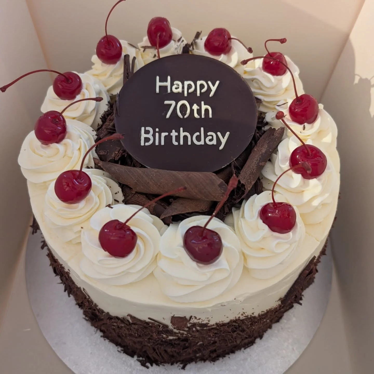This is a 10 inch black forest cake. You can't tell by the photos, but it is a humongous cake, lol. All made from scratch.  Layers of chocolate sponge cake filled with cream, cherry reduction and Morello cherries. Decorated with dark chocolate shavin