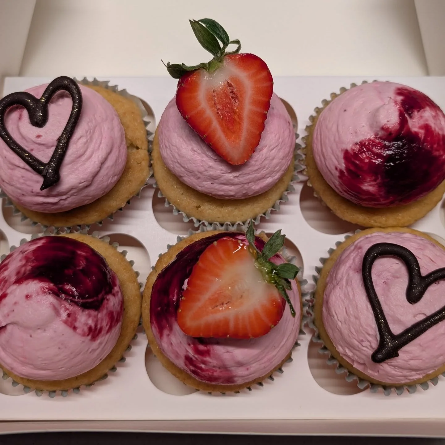 Happy Valentine's Day everyone. 😍 These are mixed berry cupcakes. Moist vanilla cupcakes topped with a marscapone/whipped cream and mixed berry reduction. I fill them with a little berry reduction too.  Lovingly made from scratch. ❤️