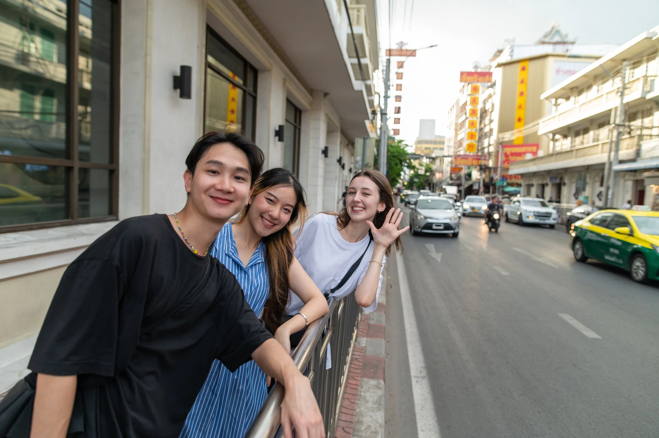 University students exploring a busy street in an Asian city during an overseas scholarship experience.