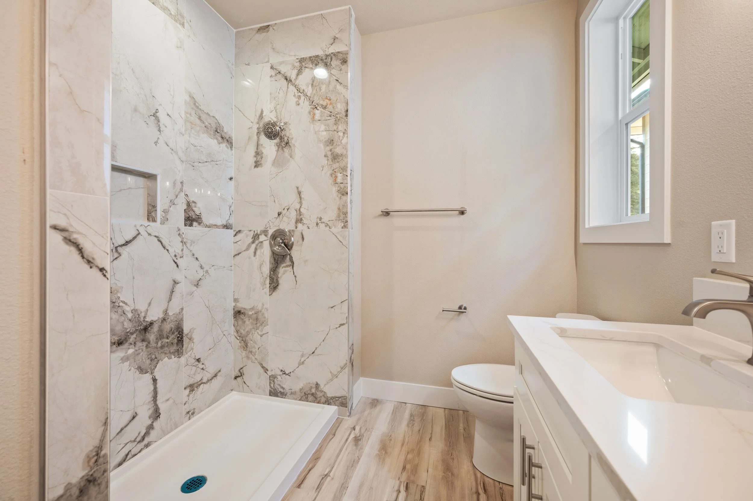 bathroom A_1125sf_RealSavi_KlamathFalls_newbuild.jpg