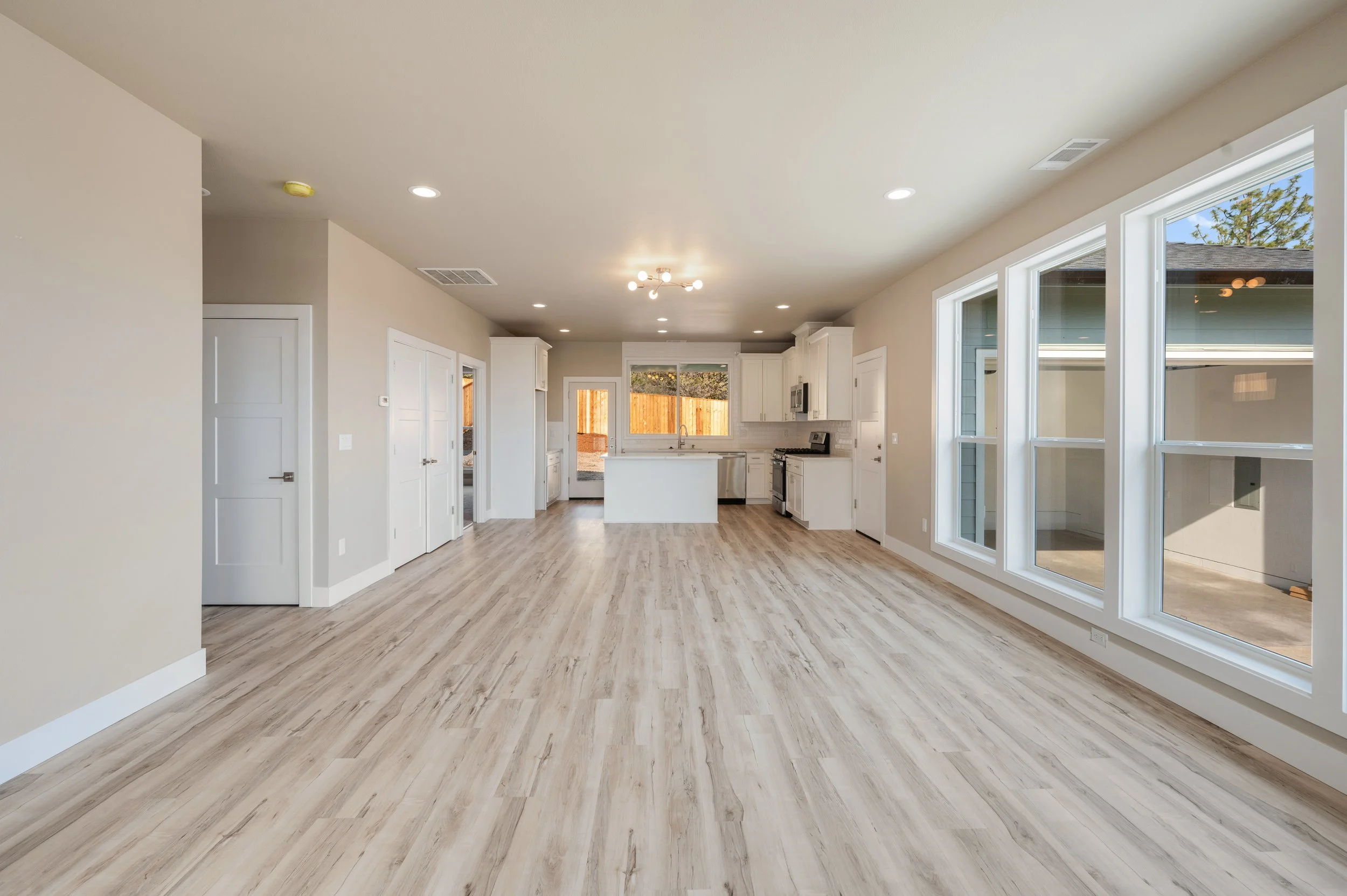 living room kitchen_1125sf_RealSavi_KlamathFalls_newbuild.jpg