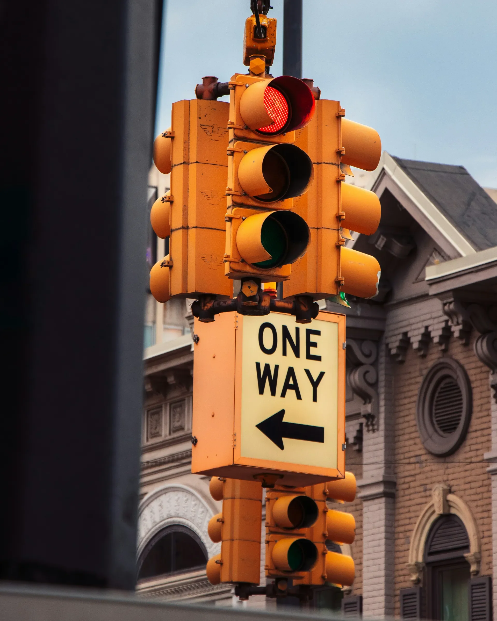 image of a traffic light and a one-way street sign