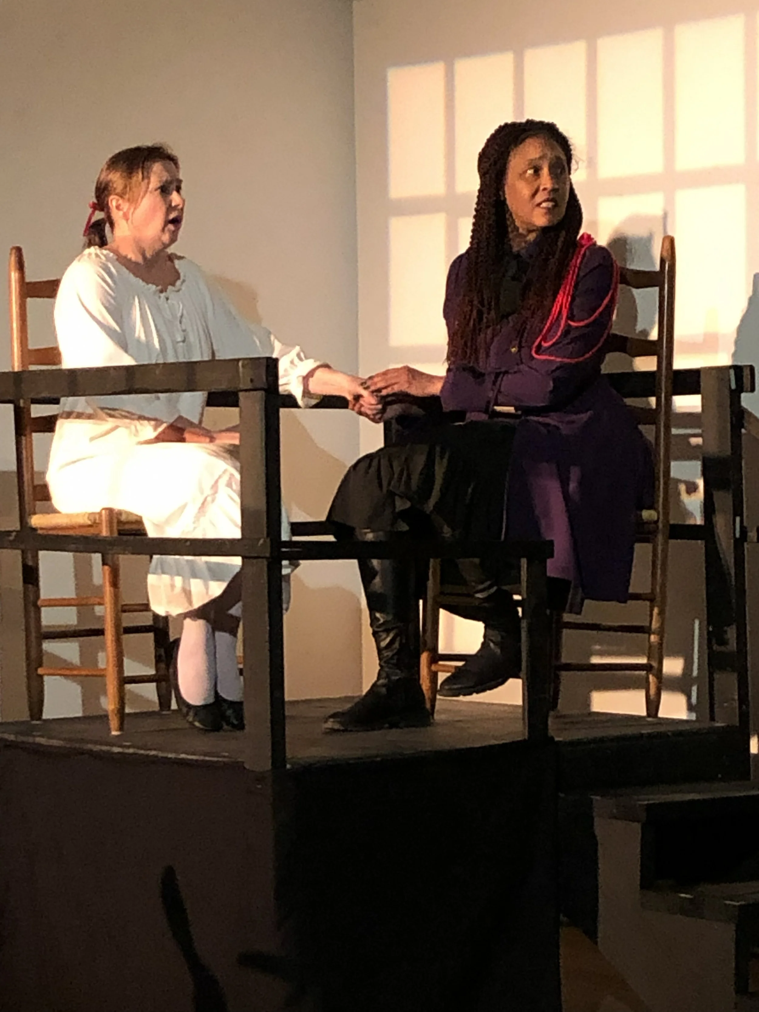  Beth Davis as **Charlotte Corday** &amp; Rav’n Moon as **Marianne Angelle**  **Photo by** Lynn Fleming 