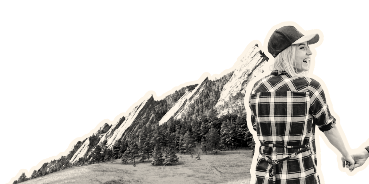 Two women with backpacks standing on a grassy plain at sunset, with mountains in the background, digital art style with a cutout effect.