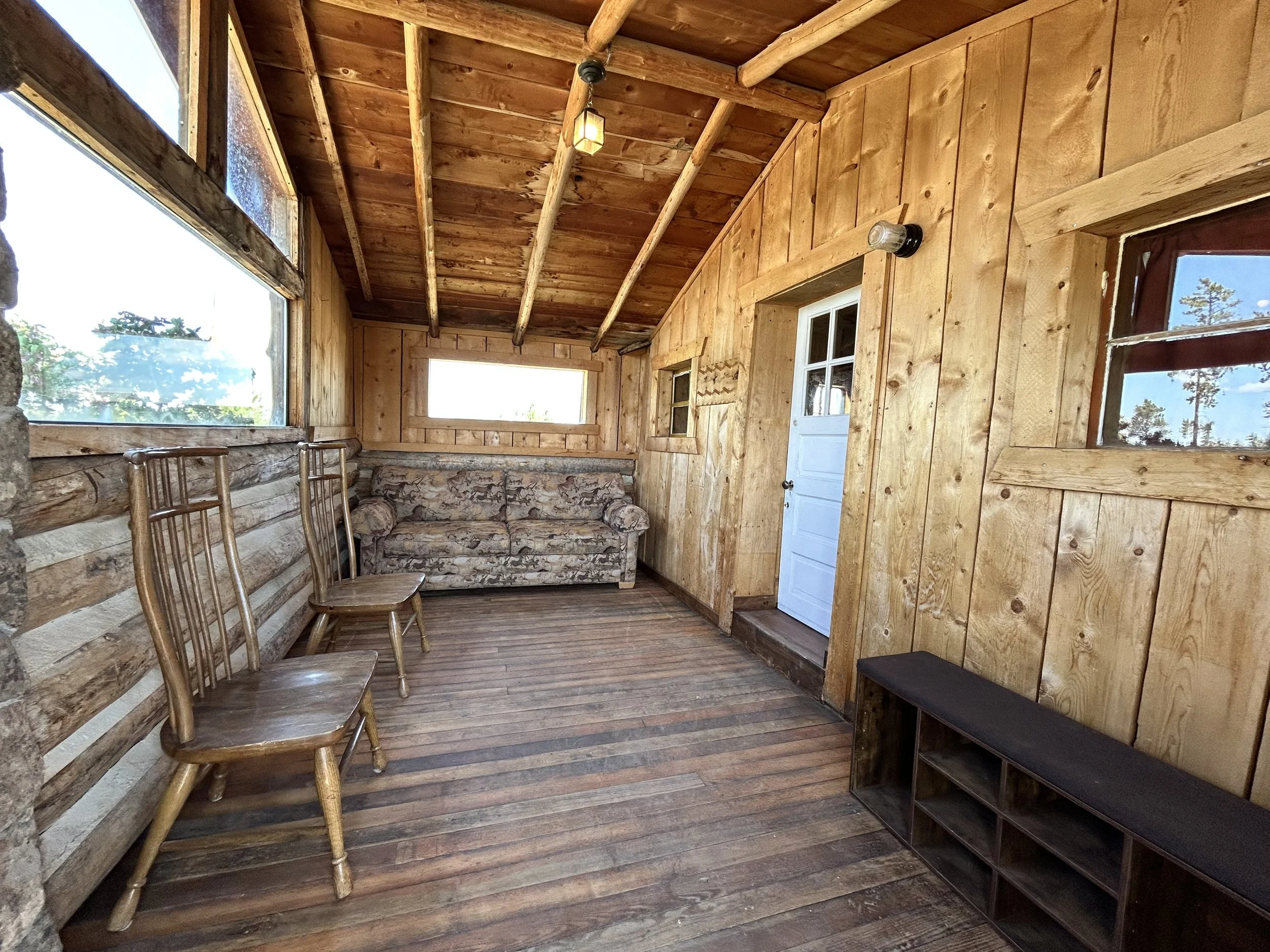 Cabin 1 enclosed front porch with pullout sofa