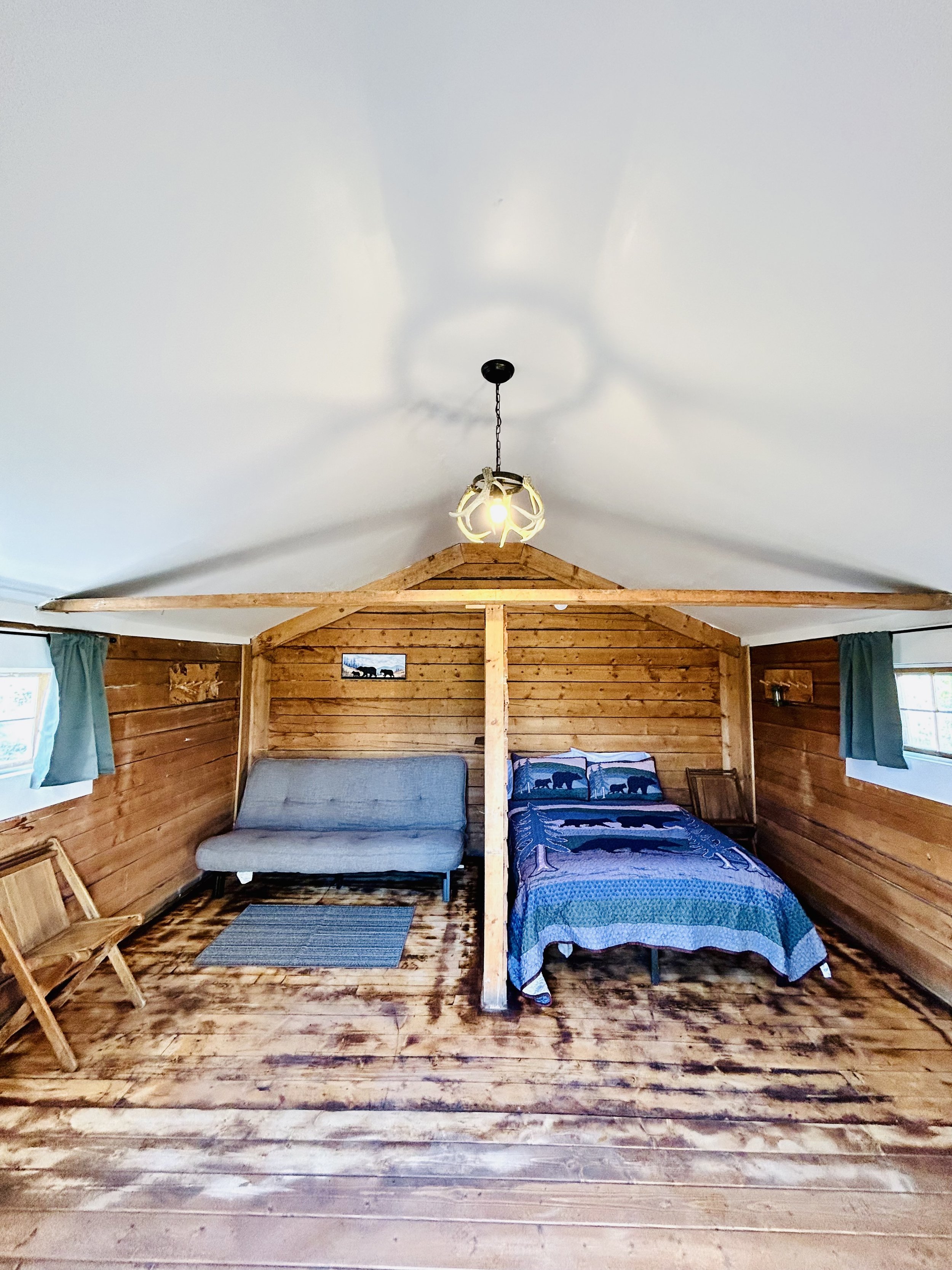 Cabin 12 interior with full bed and futon