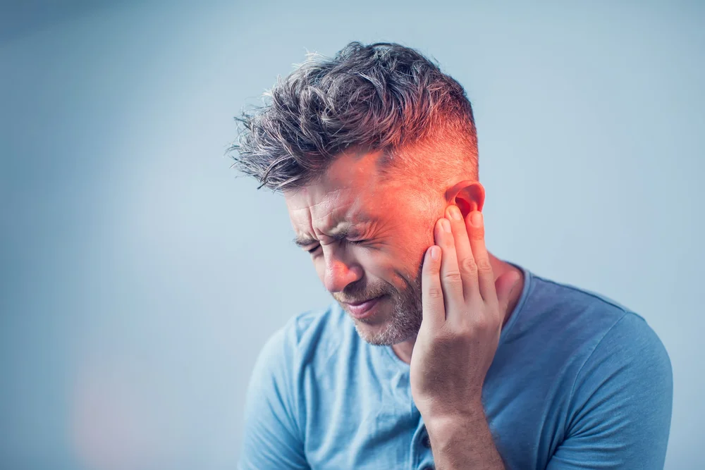Person experiencing sound sensitivity