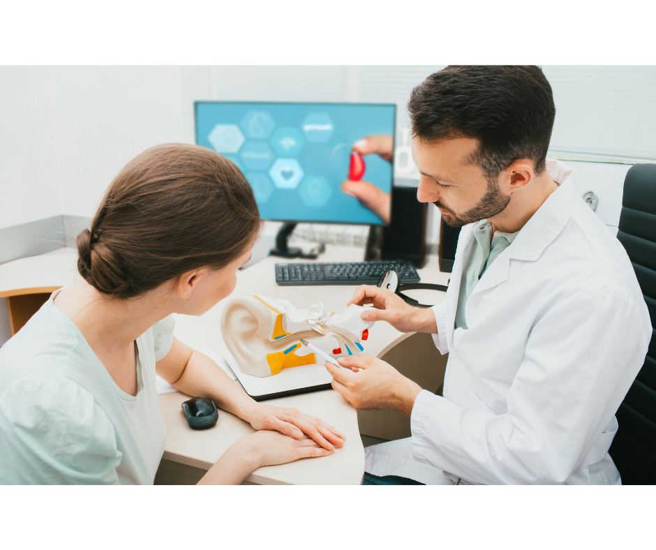 Clinician explaining the ear and hearing system during a consultation